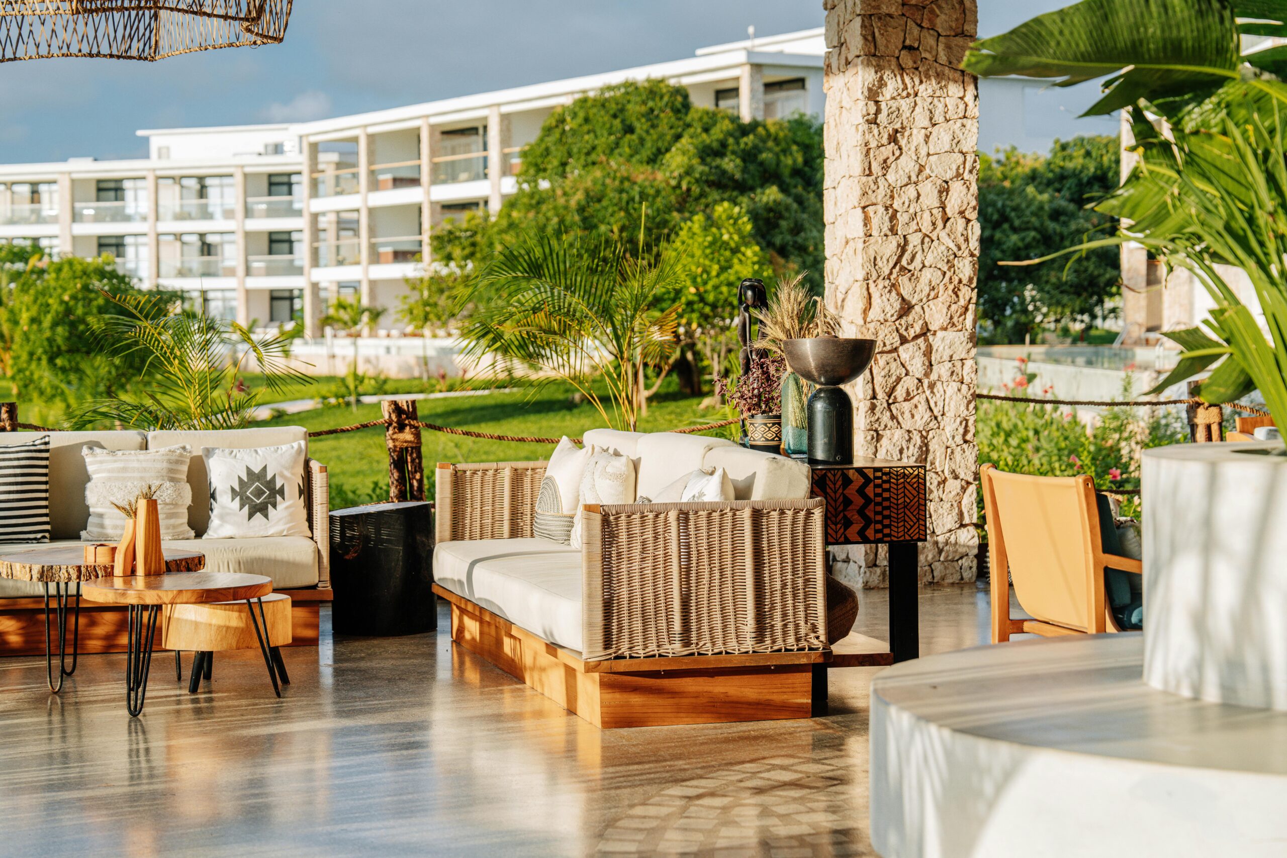 Elegant outdoor seating area with tropical decor in Zanzibar resort.